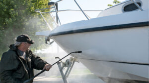 Cleaner uses a high pressure to clean a boat
